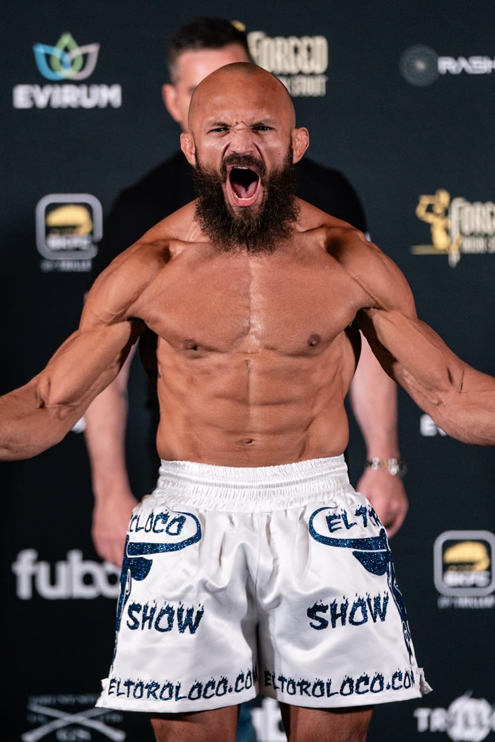 Edgard Plazaola roaring at the camera during a BKFC weigh-in